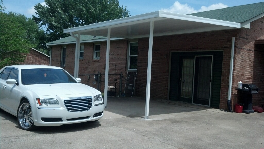 White car parked under carport.