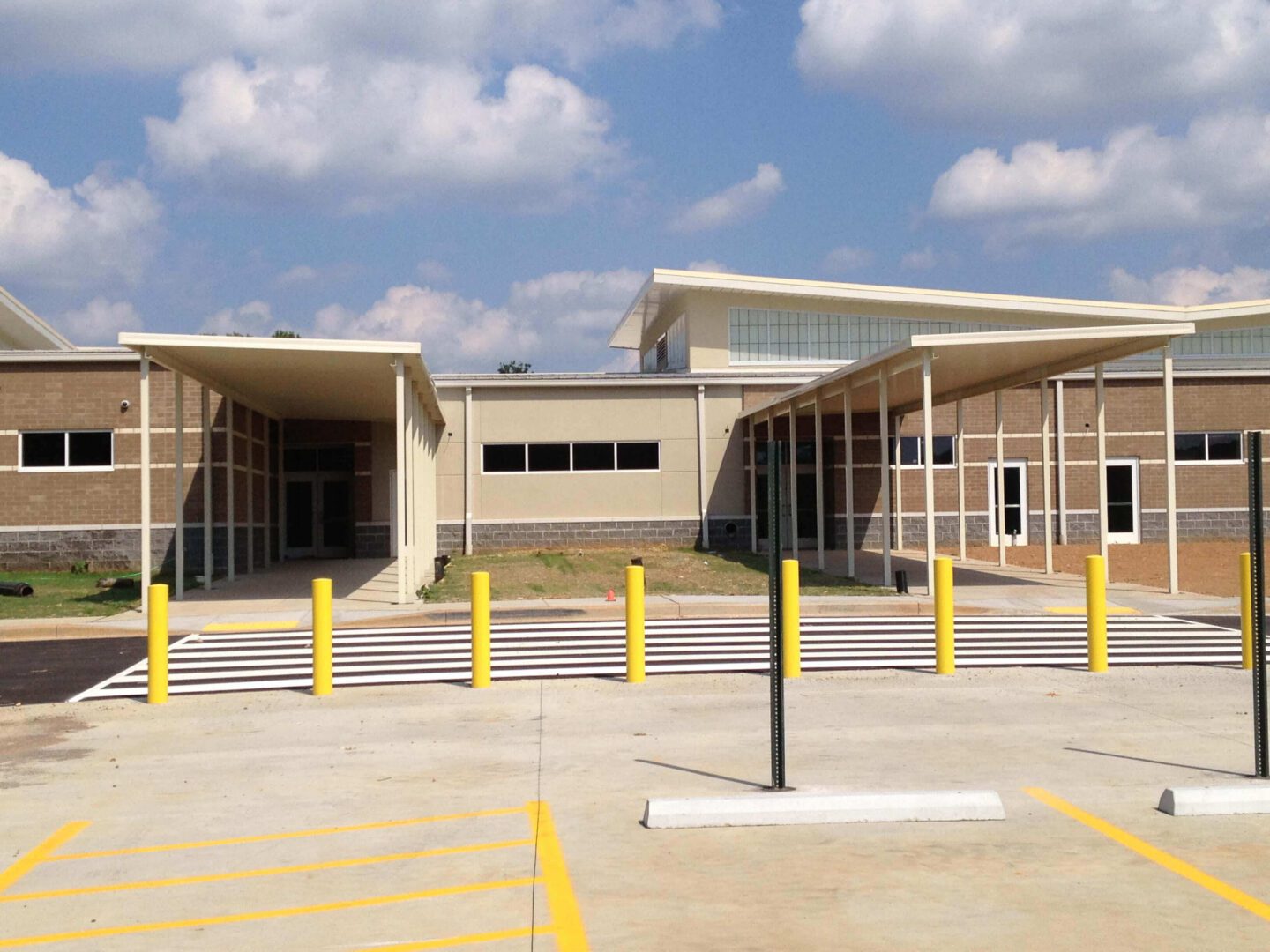 Modern school building entrance with canopy.
